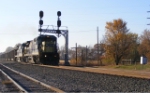 CSX 7568 leads coal loads past KN cabin